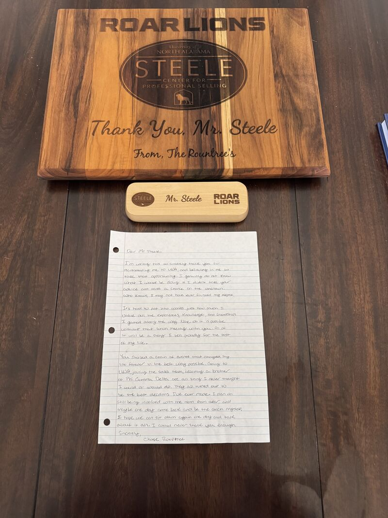 Custom Steele Center cutting board and handwritten thank-you note from Chase Rountree to Mr. Steele